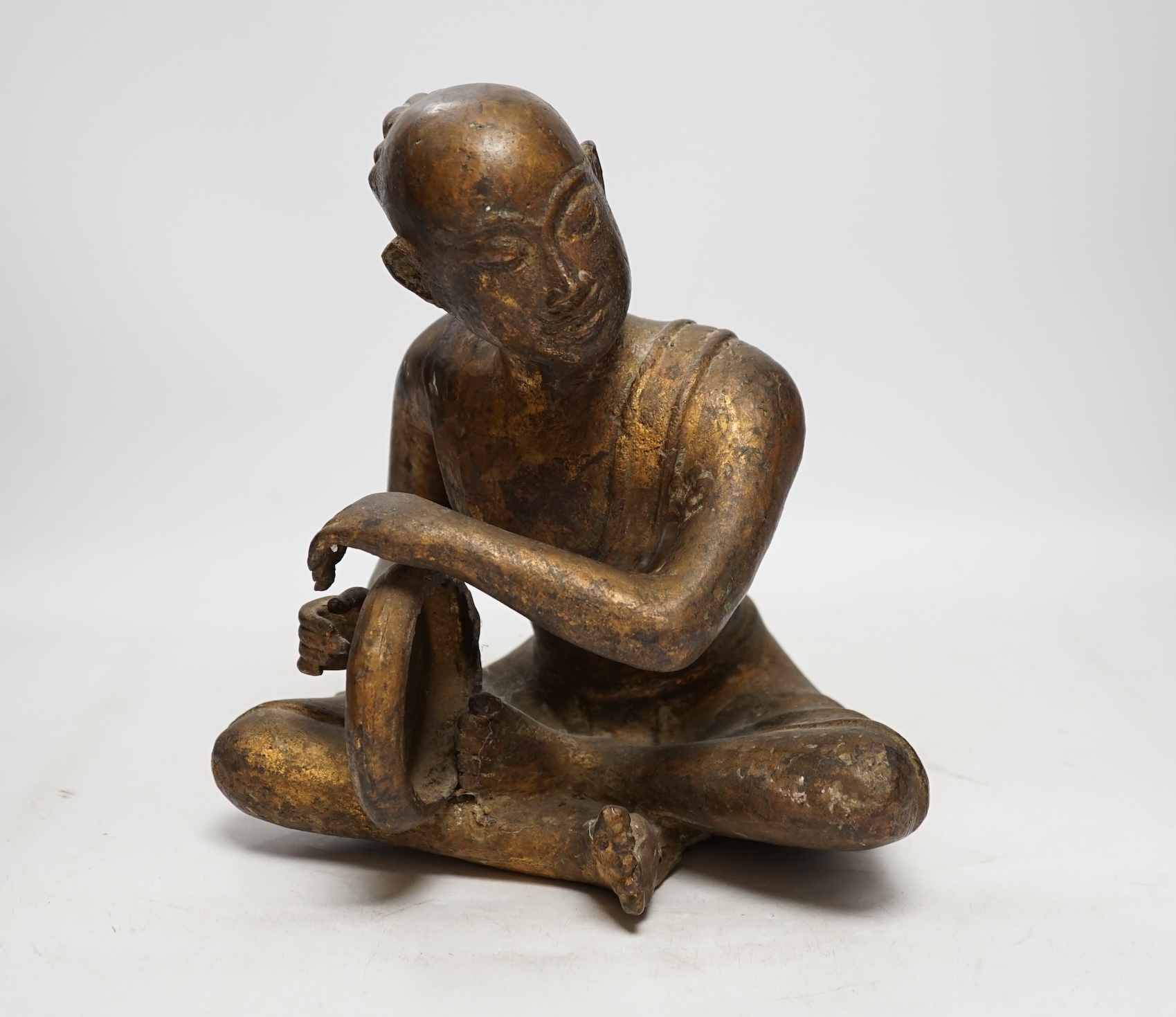 A South East Asian bronze and composition figure, 27cm high. Condition - fair